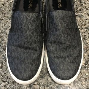Michael Kors black logo slip on shoes/sneaker